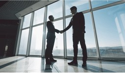 Two man handshaking — Property Investment in Broadbeach, QLD